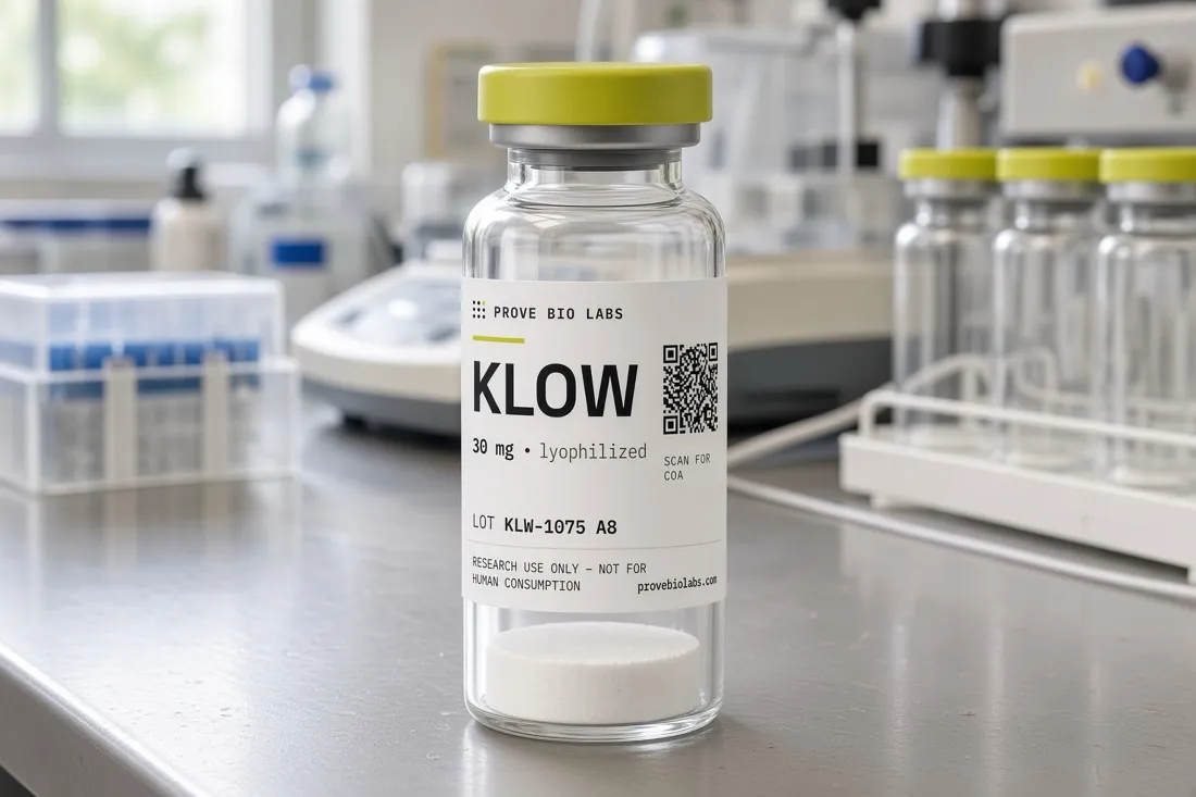 A labelled research vial on a laboratory bench beside a rack of empty vials